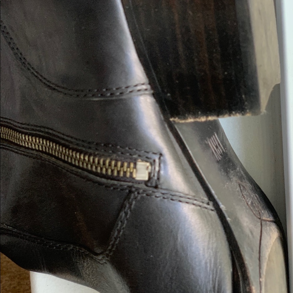 Over the knee black Frye boots.